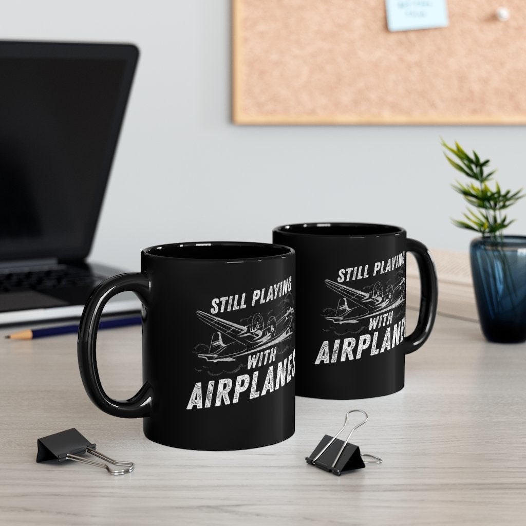 STILL PLAYING WITH AIRPLANES DESIGNED - MUG Printify